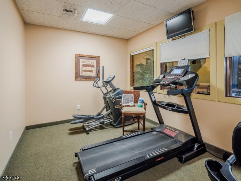 1 Trinity Street, Unit 1 Newton, NJ 07860 - Photo 4 of 5 a room with gym equipment and wooden floor