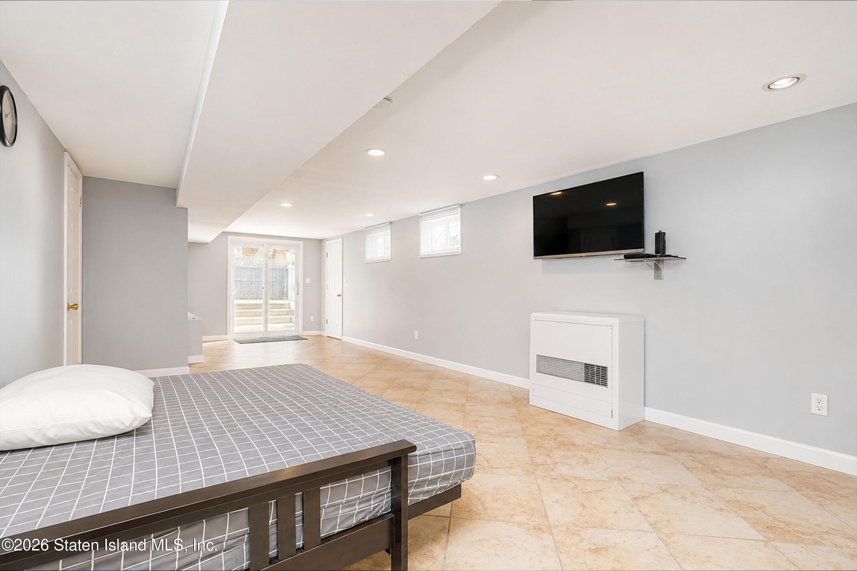 37 Middle Loop Road Staten Island, NY 10308 - Photo 29 of 38 a bedroom with a bed and a flat screen tv