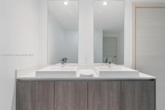 a bedroom with a bed and ceiling fan