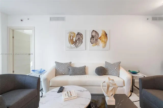 a living room with furniture and a couch