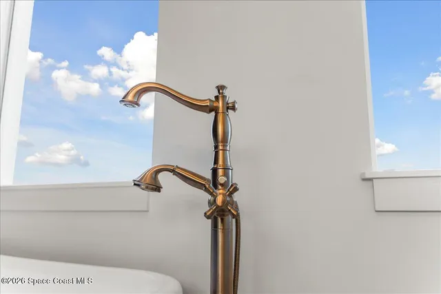 a bathroom with a sink and mirror