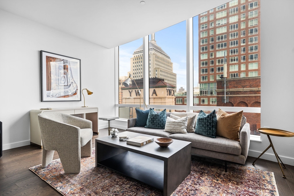 40 Trinity Place, Unit 1603 Boston, MA 02116 - Photo 5 of 11 a living room with furniture and a large window