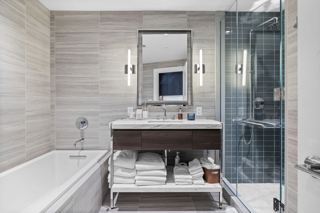 40 Trinity Place, Unit 1603 Boston, MA 02116 - Photo 9 of 11 a bathroom with a sink and a bathtub
