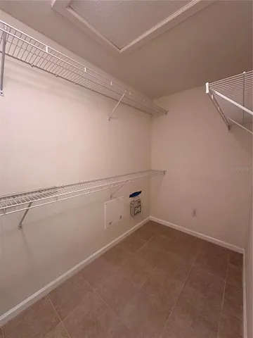 a view of a room with racks on the wall
