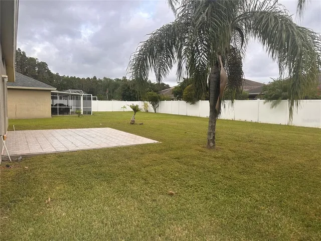 a view of swimming pool with a yard