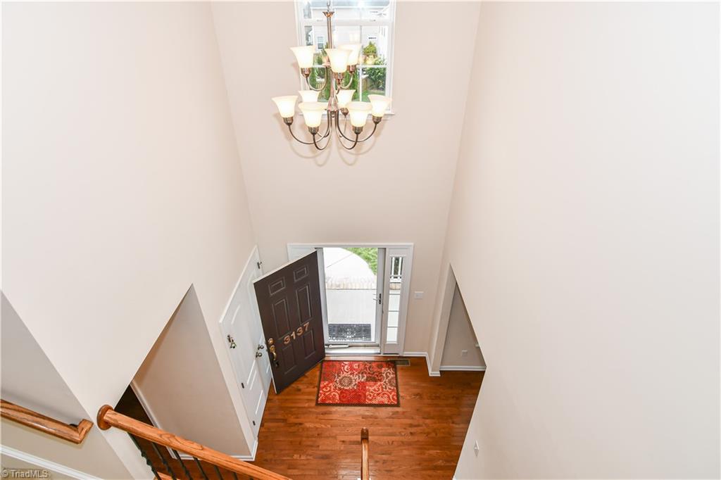 3137 Cranberry Ridge Drive High Point, NC 27265 - Photo 2 of 25 This beautiful two-story foyer welcomes you inside with a full-view storm door + side lights and beautiful hardwood flooring.