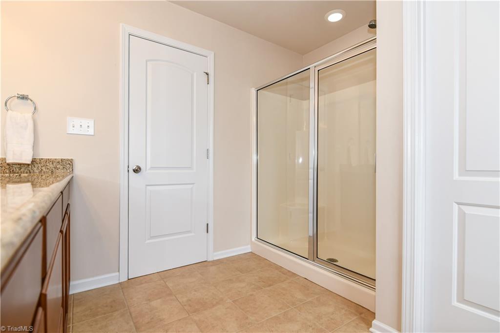 3137 Cranberry Ridge Drive High Point, NC 27265 - Photo 13 of 25 The master bathroom also features a linen closet, separate shower with double bench, and private toilet closet.