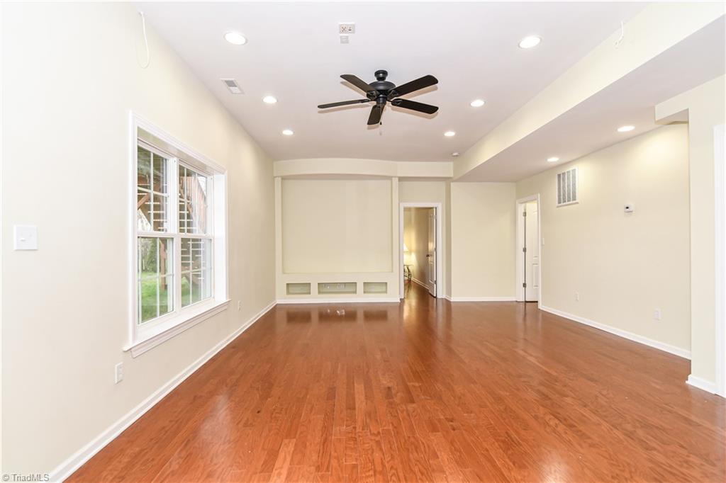 3137 Cranberry Ridge Drive High Point, NC 27265 - Photo 20 of 25 The recreation room has laminate wood flooring, recessed lighting, and is wired for home theater.