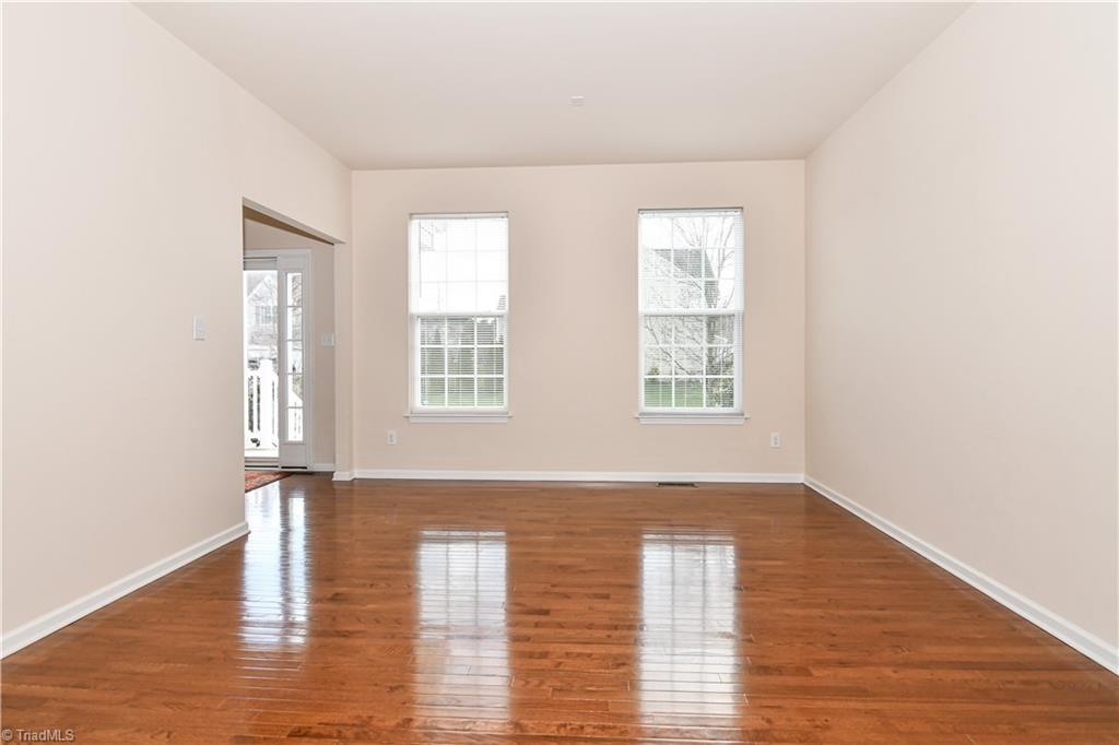 3137 Cranberry Ridge Drive High Point, NC 27265 - Photo 4 of 25 The formal living room is filled with natural light and is spacious in size! This area has two windows with blinds and hardwood flooring. *Note, 9' ceilings on main level!