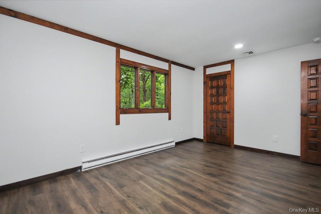18 Hillside View Road Mahopac, NY 10541 - Photo 35 of 42 an empty room with wooden floor and windows