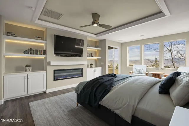 a living room with furniture fireplace and flat screen tv