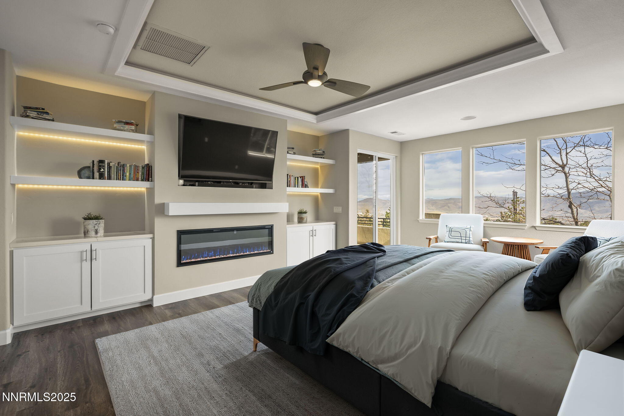 5640 Rue St Tropez Reno, NV 89511 - Photo 18 of 55 a spacious bedroom with a bed and a flat screen tv