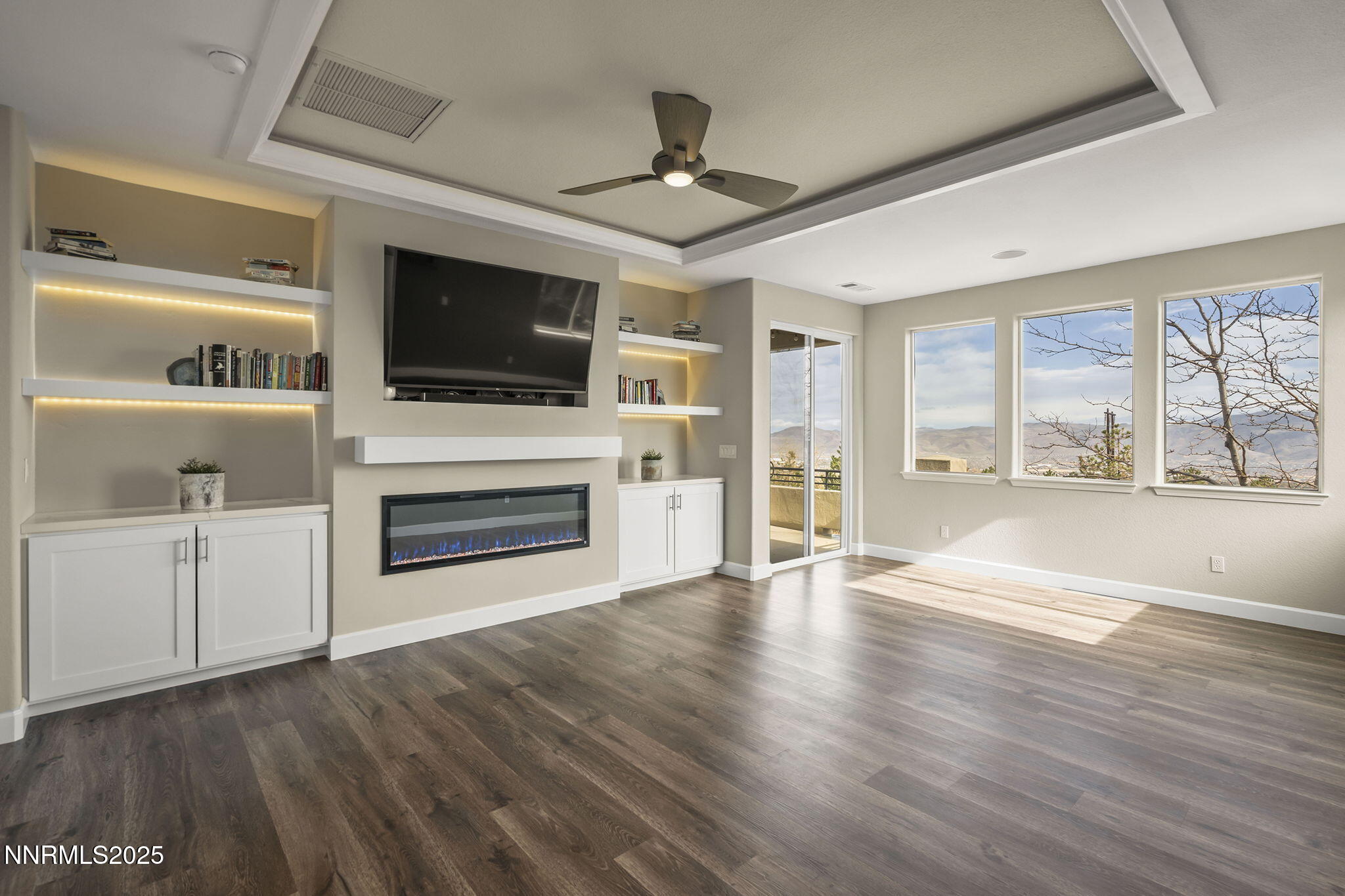 5640 Rue St Tropez Reno, NV 89511 - Photo 19 of 55 a living room with furniture fireplace and flat screen tv