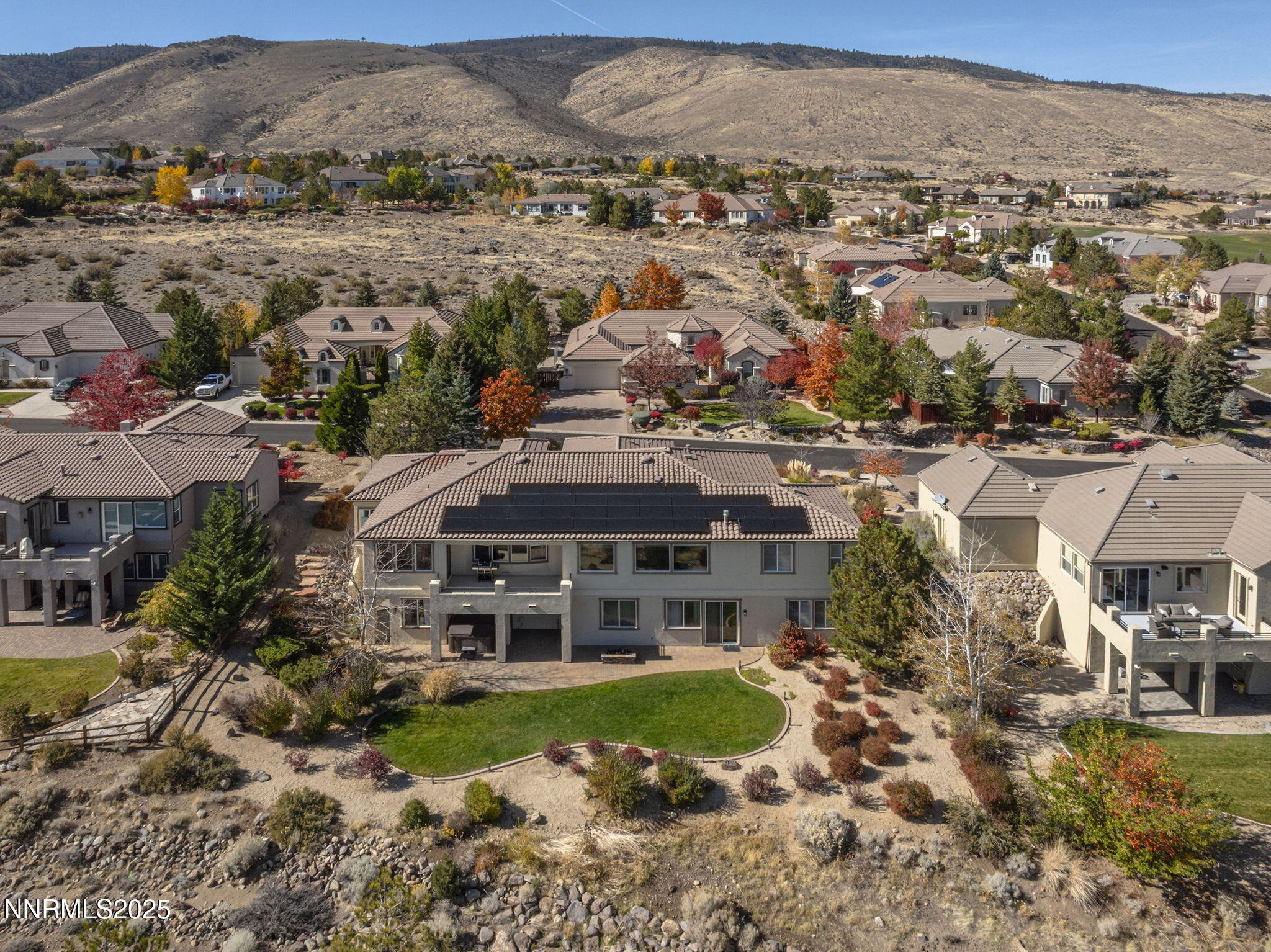 5640 Rue St Tropez Reno, NV 89511 - Photo 2 of 55 an aerial view of residential houses with outdoor space and trees