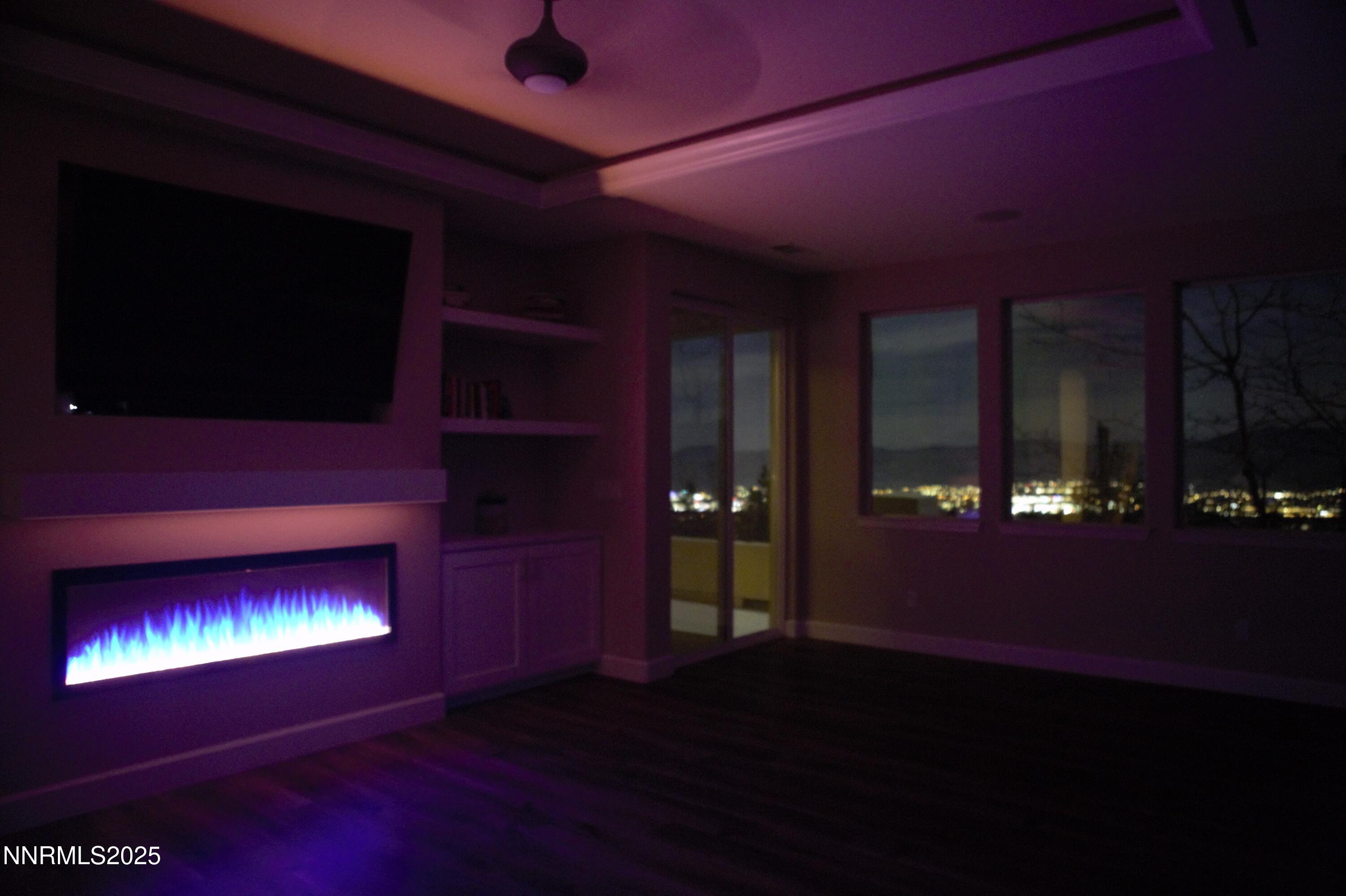 5640 Rue St Tropez Reno, NV 89511 - Photo 21 of 55 a room with bed and a fireplace