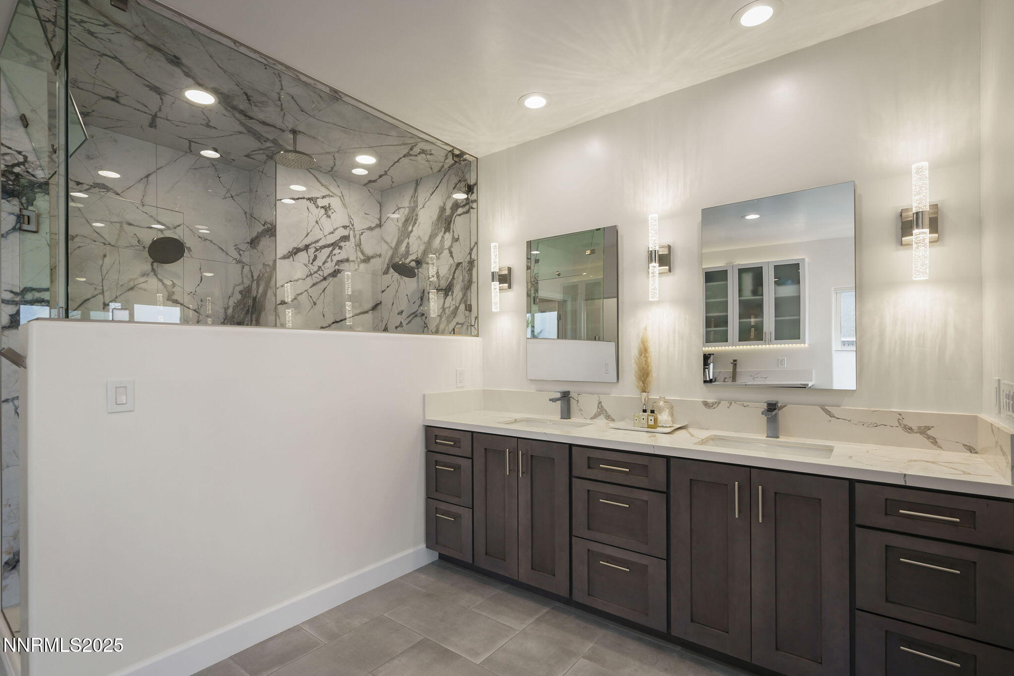 5640 Rue St Tropez Reno, NV 89511 - Photo 22 of 55 a bathroom with a double vanity sink mirror and double