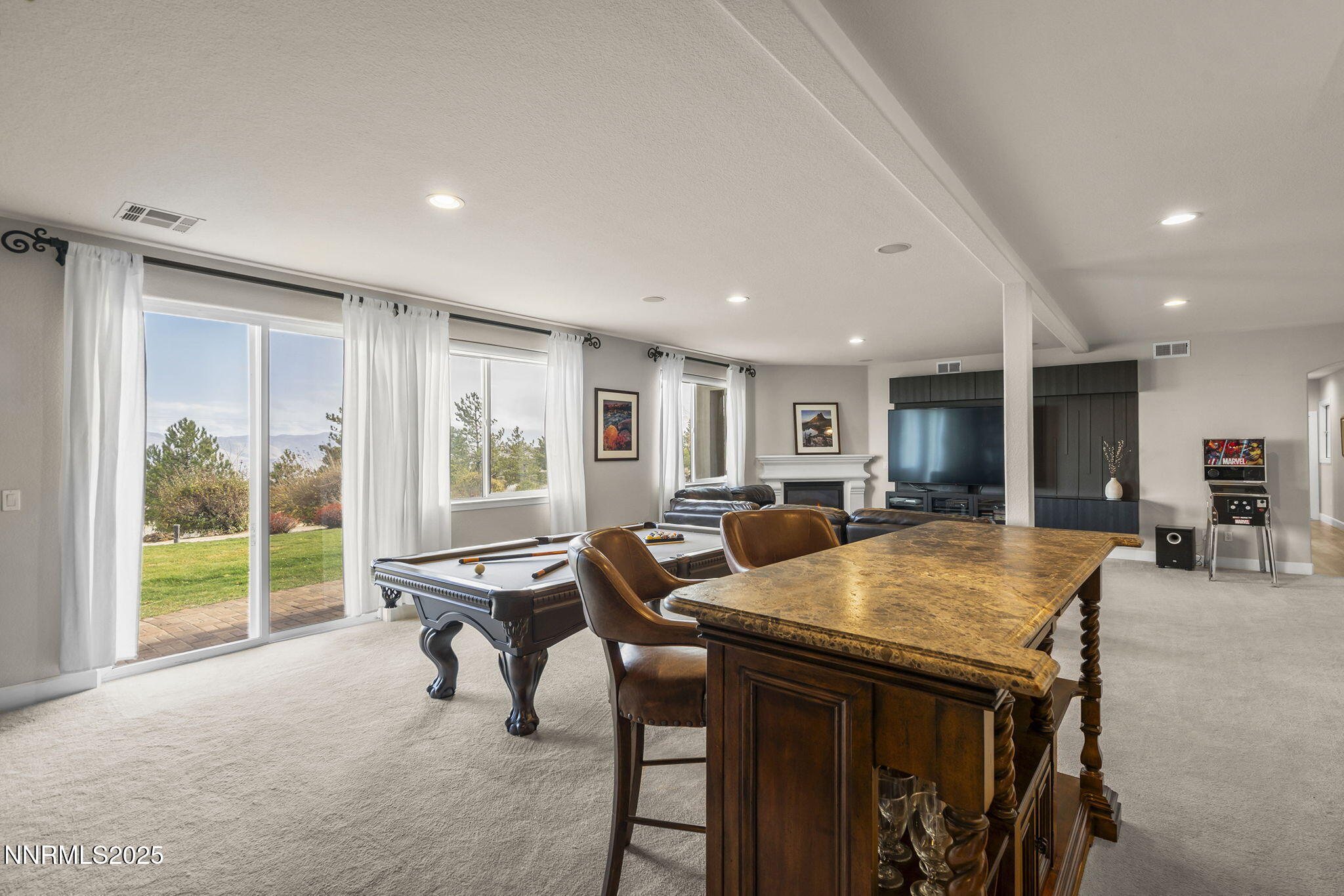 5640 Rue St Tropez Reno, NV 89511 - Photo 25 of 55 a view of a dining room with furniture and a large window