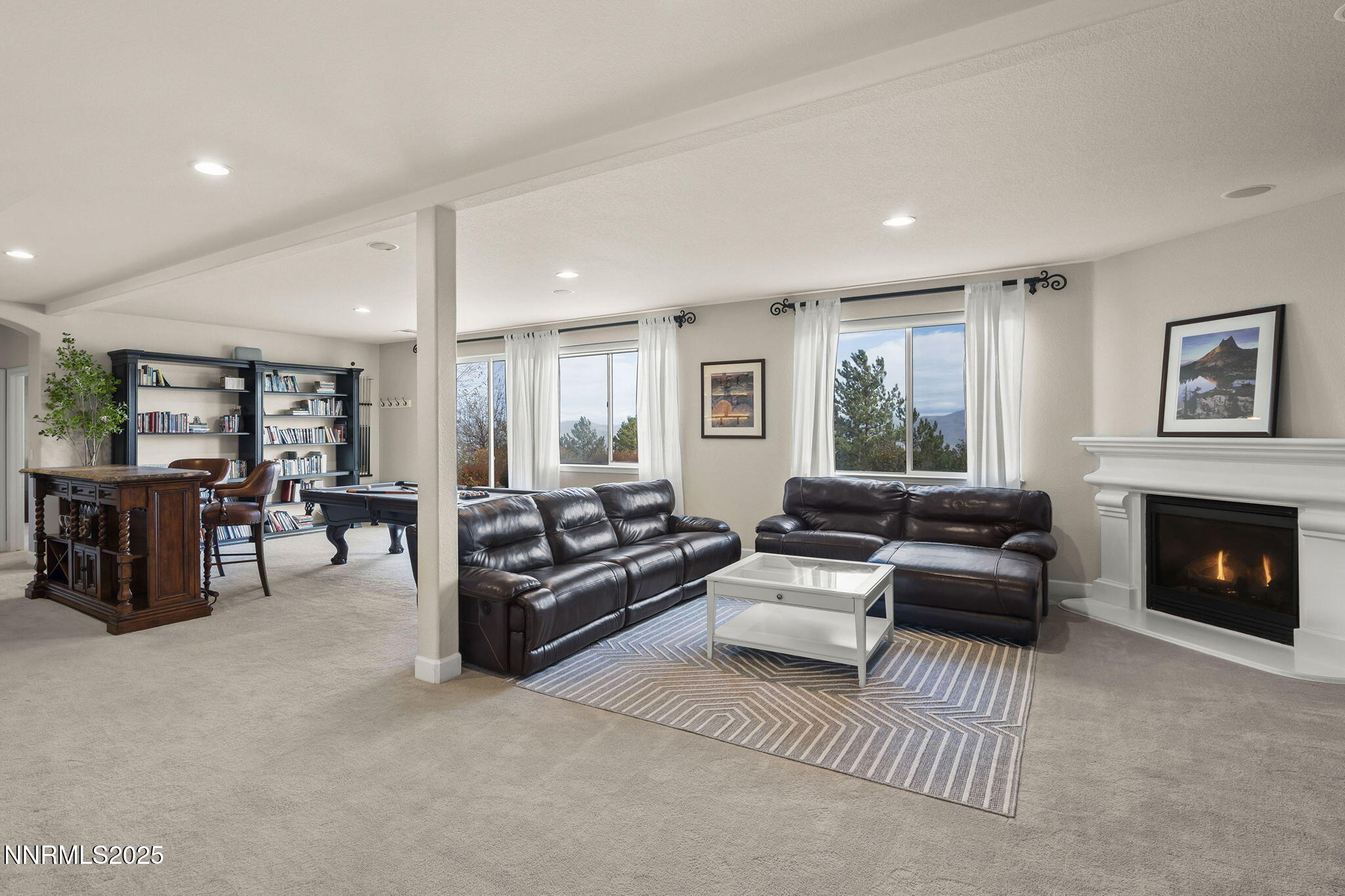 5640 Rue St Tropez Reno, NV 89511 - Photo 26 of 55 a living room with furniture and a fireplace