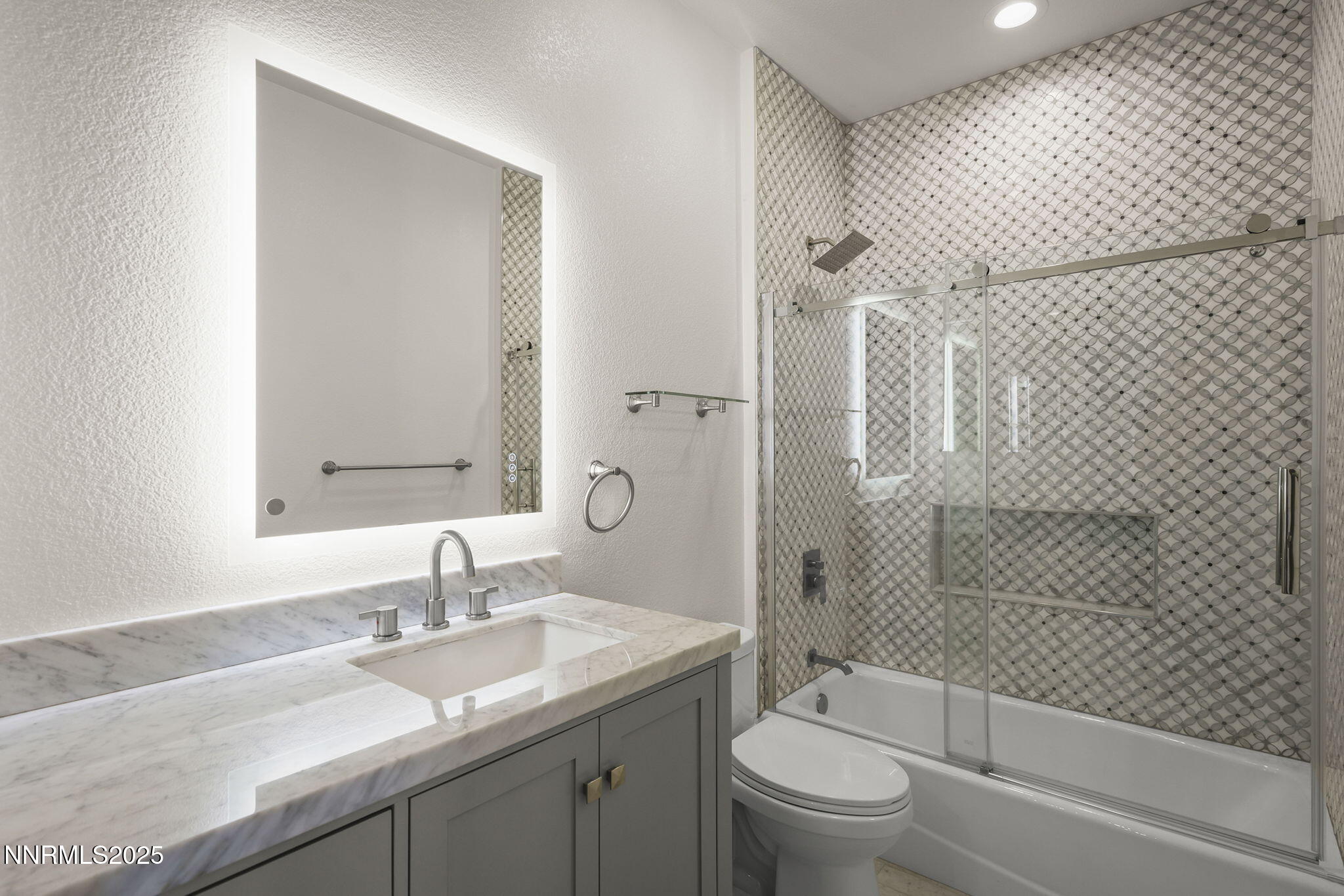 5640 Rue St Tropez Reno, NV 89511 - Photo 35 of 55 a bathroom with a granite countertop sink a toilet and shower