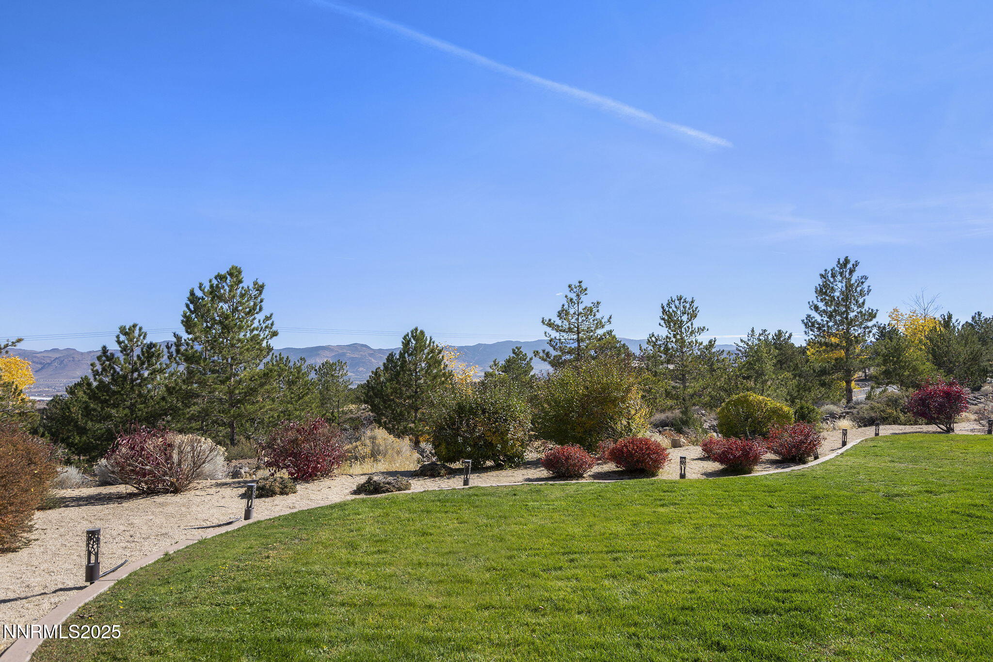 5640 Rue St Tropez Reno, NV 89511 - Photo 46 of 55 a backyard of a house with lots of green space and outdoor seating
