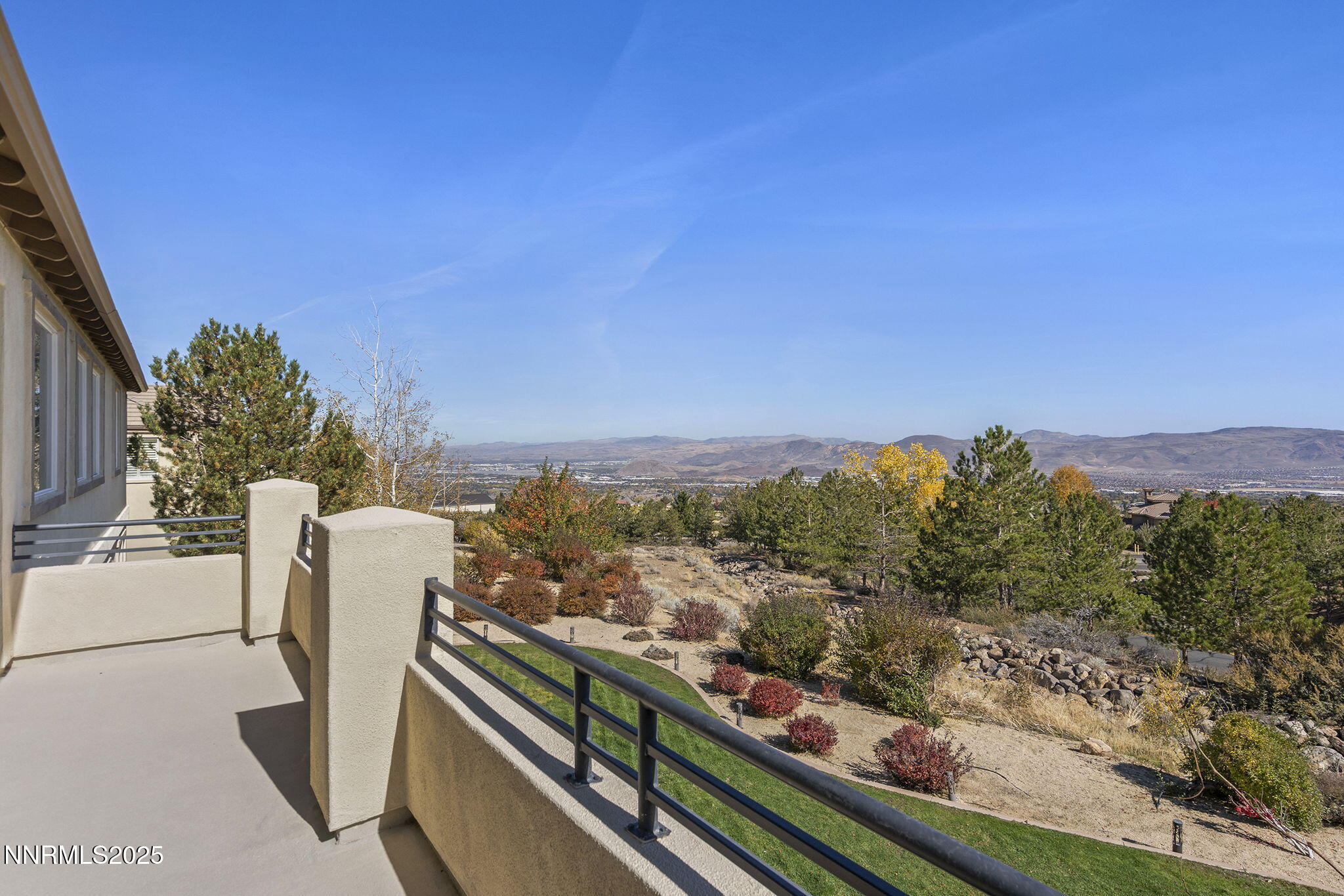 5640 Rue St Tropez Reno, NV 89511 - Photo 48 of 55 a view of a city from a balcony with furniture