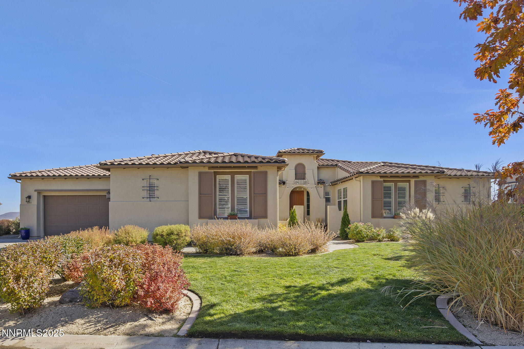 5640 Rue St Tropez Reno, NV 89511 - Photo 50 of 55 a front view of a house with garden