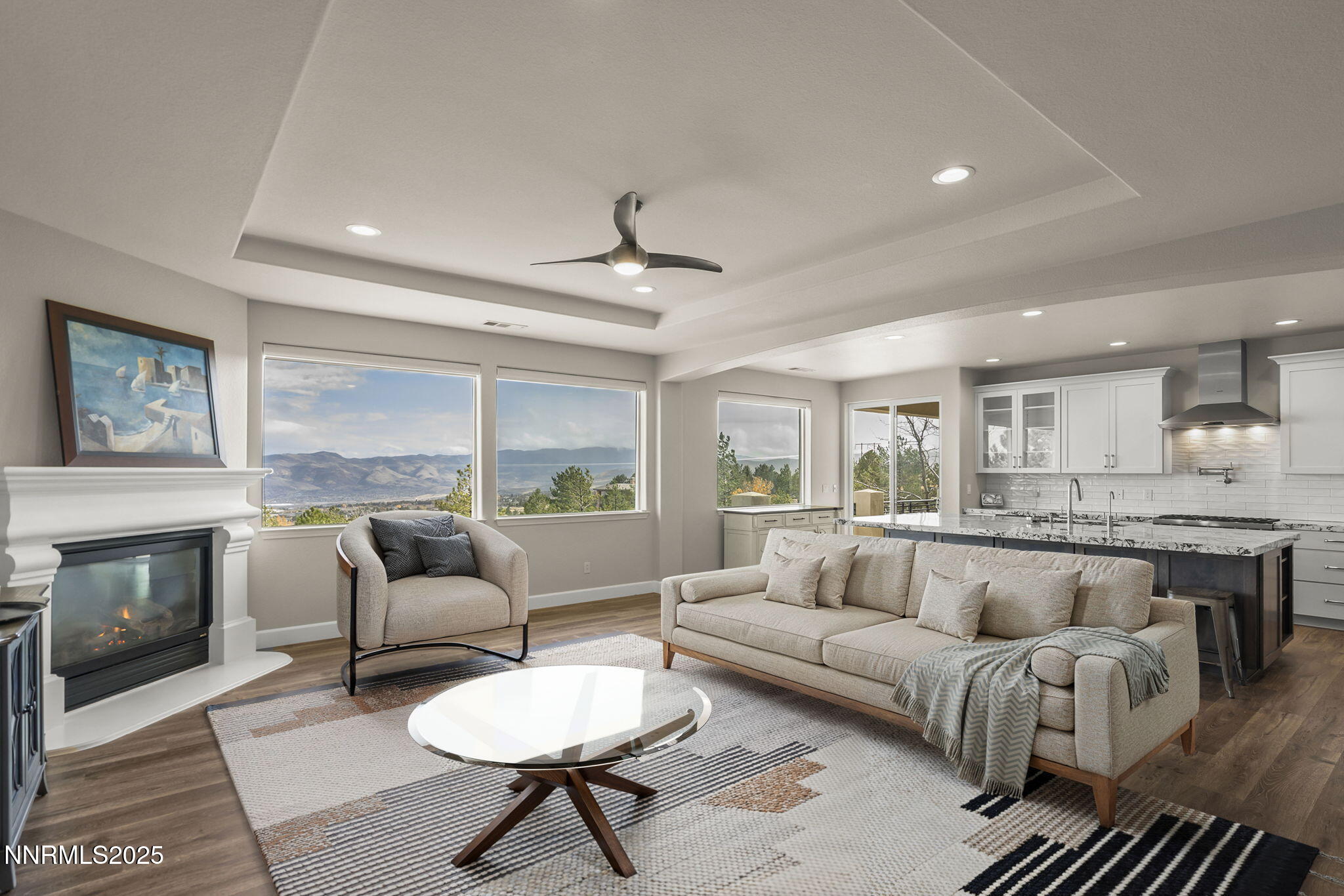 5640 Rue St Tropez Reno, NV 89511 - Photo 5 of 55 a living room with furniture and a fireplace