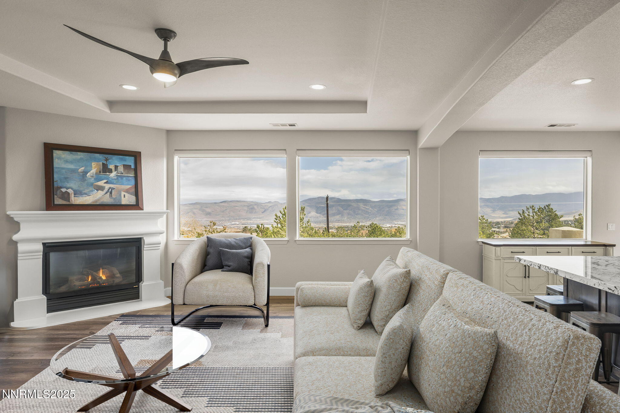 5640 Rue St Tropez Reno, NV 89511 - Photo 7 of 55 a living room with furniture and a fireplace