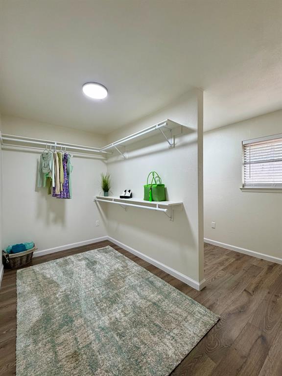 3609 Country Club Road Arlington, TX 76013 - Photo 27 of 40 an empty room with wooden floor and window