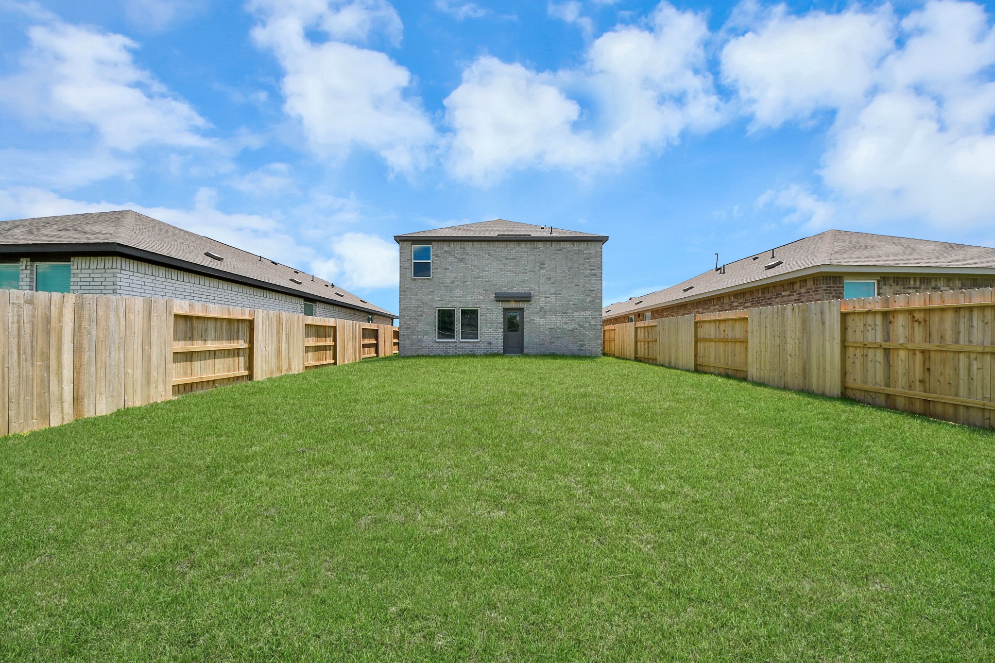 2931 Summer Breeze Way Angleton, TX 77515 - Photo 26 of 30 a view of a house with backyard and garden