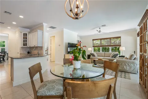 a dining room with furniture a window and a view