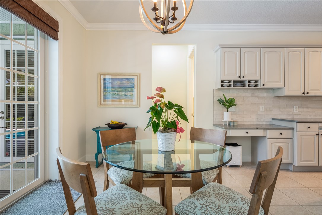 886 Carolina Circle Southwest Vero Beach, FL 32962 - Photo 14 of 36 a view of a dining room with furniture