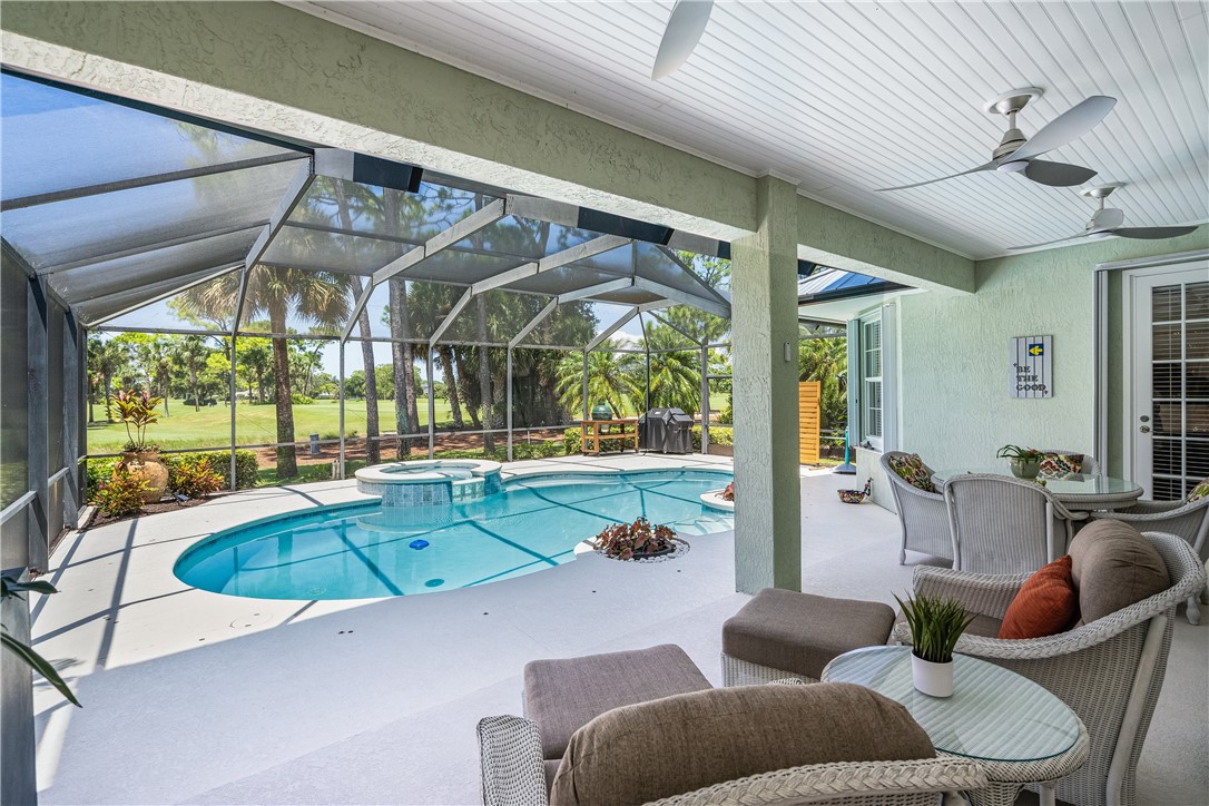 886 Carolina Circle Southwest Vero Beach, FL 32962 - Photo 28 of 36 a living room with furniture and a large window