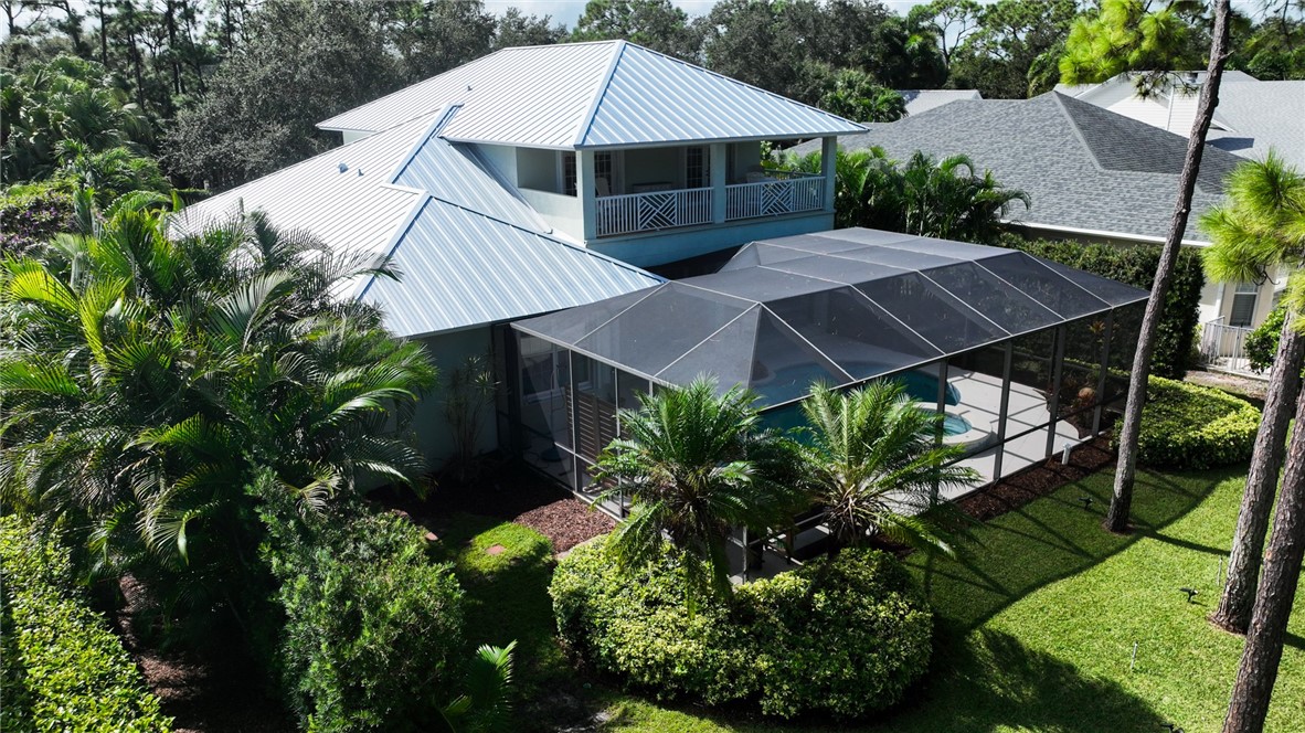 886 Carolina Circle Southwest Vero Beach, FL 32962 - Photo 30 of 36 an aerial view of a house with yard and outdoor seating