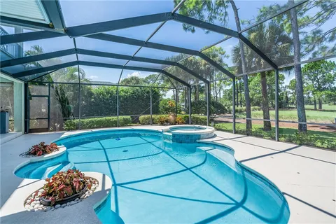 a view of a backyard with sitting area