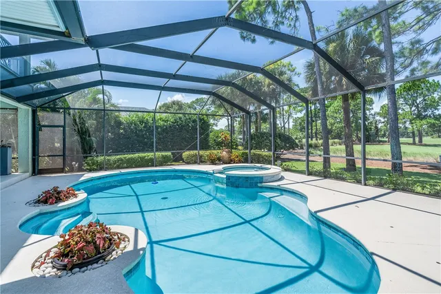 a view of a backyard with sitting area