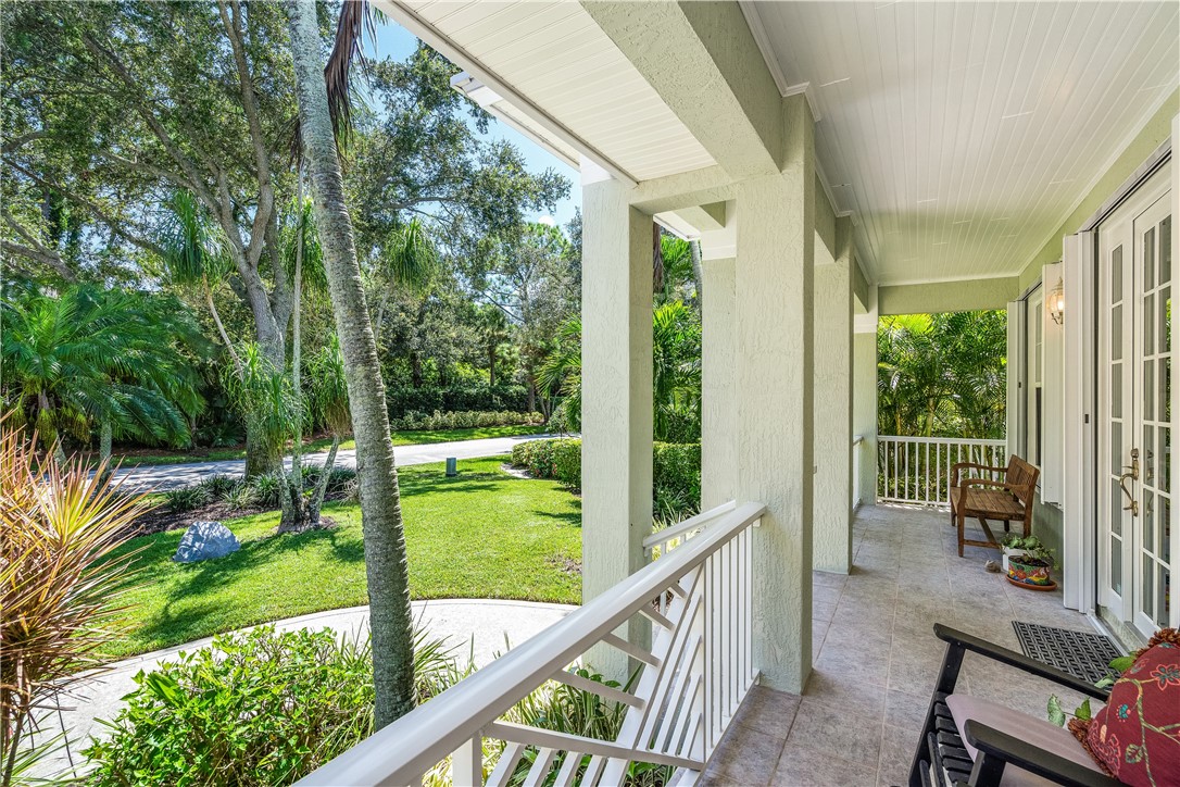 886 Carolina Circle Southwest Vero Beach, FL 32962 - Photo 31 of 36 a view of a porch with chairs and backyard