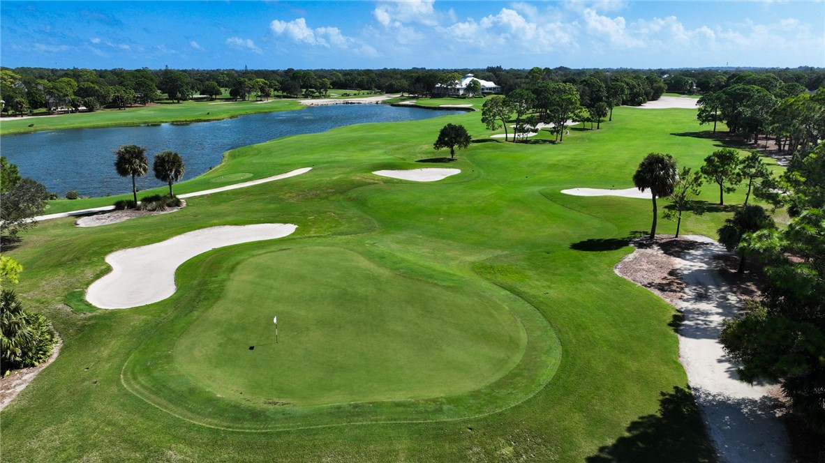 886 Carolina Circle Southwest Vero Beach, FL 32962 - Photo 32 of 36 a view of a lake with a yard