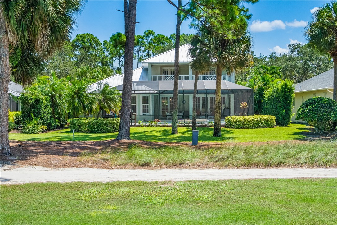 886 Carolina Circle Southwest Vero Beach, FL 32962 - Photo 5 of 36 a view of a house with a yard and plants
