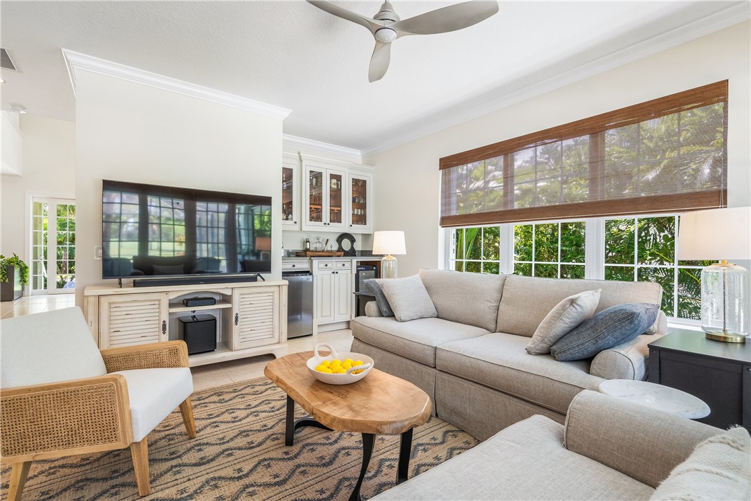 886 Carolina Circle Southwest Vero Beach, FL 32962 - Photo 6 of 36 a living room with furniture and a large window