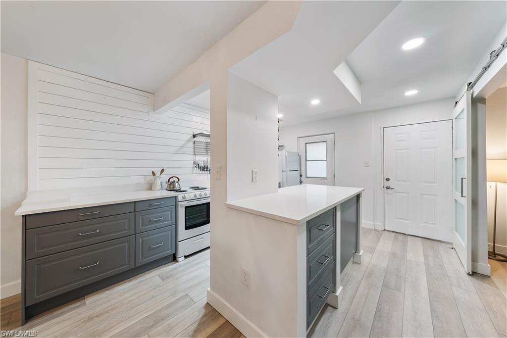 72 7th Street South, Unit 310 Naples, FL 34102 - Photo 4 of 24 a kitchen with a sink and cabinets