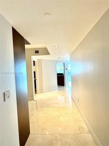 a view of hallway with a white wall