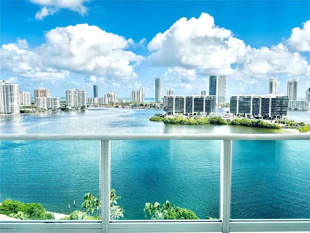a view of residential houses with outdoor space and lake view