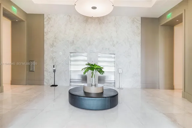 a coffee table with a potted plant and a mirror