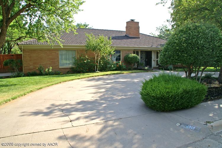 6910 Calumet Road Amarillo, TX 79106 - Photo 1 of 26 a front view of a house with garden