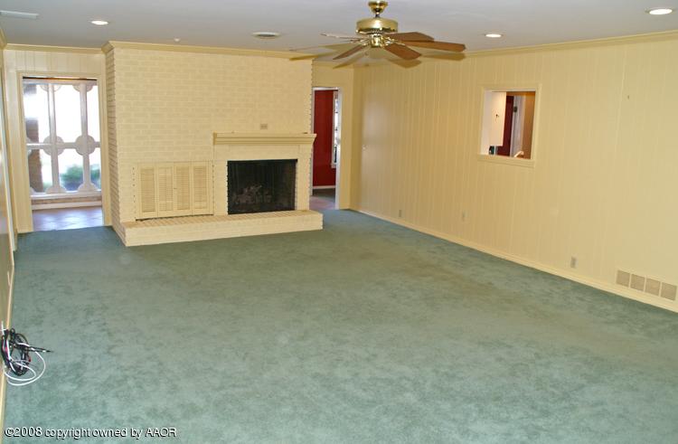 6910 Calumet Road Amarillo, TX 79106 - Photo 11 of 26 a view of empty room with a fireplace
