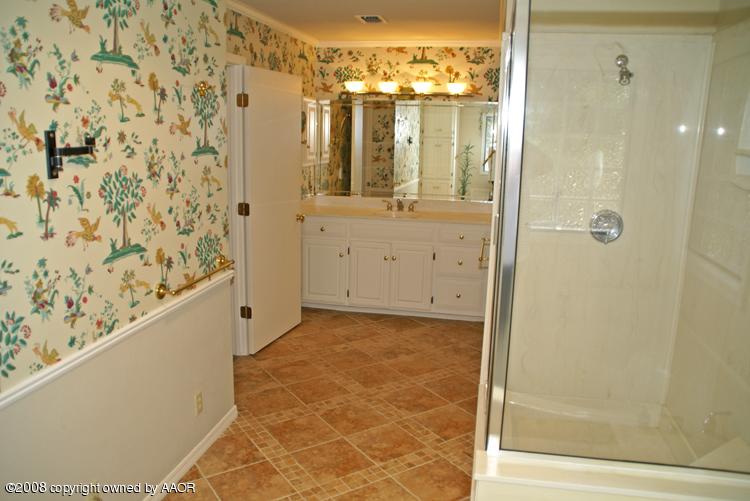 6910 Calumet Road Amarillo, TX 79106 - Photo 17 of 26 a bathroom with a shower