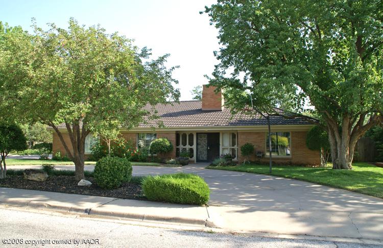 6910 Calumet Road Amarillo, TX 79106 - Photo 2 of 26 a front view of a house with a yard