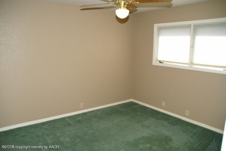 6910 Calumet Road Amarillo, TX 79106 - Photo 22 of 26 an empty room with a window