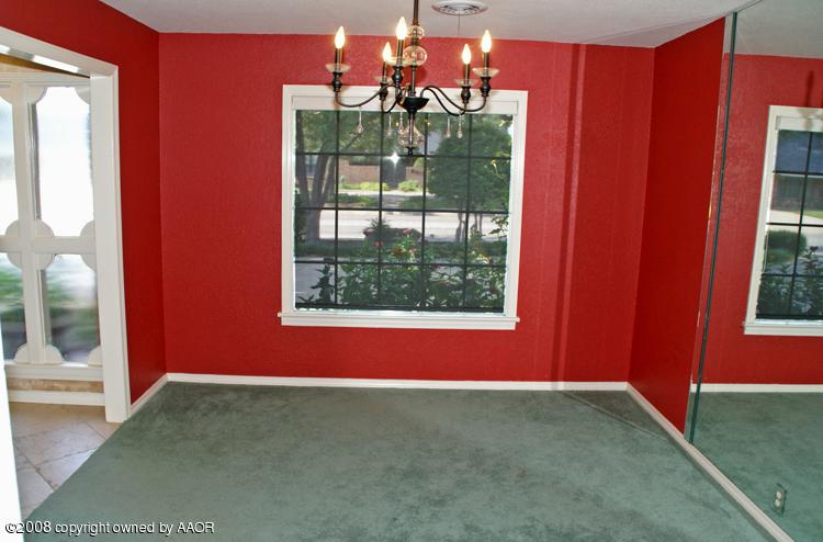 6910 Calumet Road Amarillo, TX 79106 - Photo 5 of 26 a room with furniture and a window